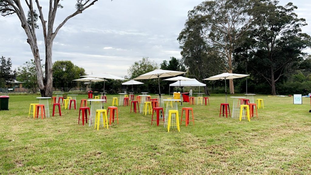 red, yellow, orange tolix stools outdoors