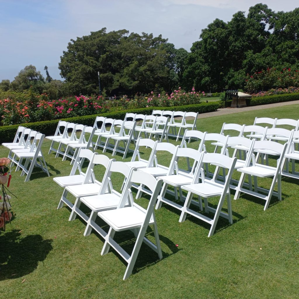 White padded folding chair outdoor event