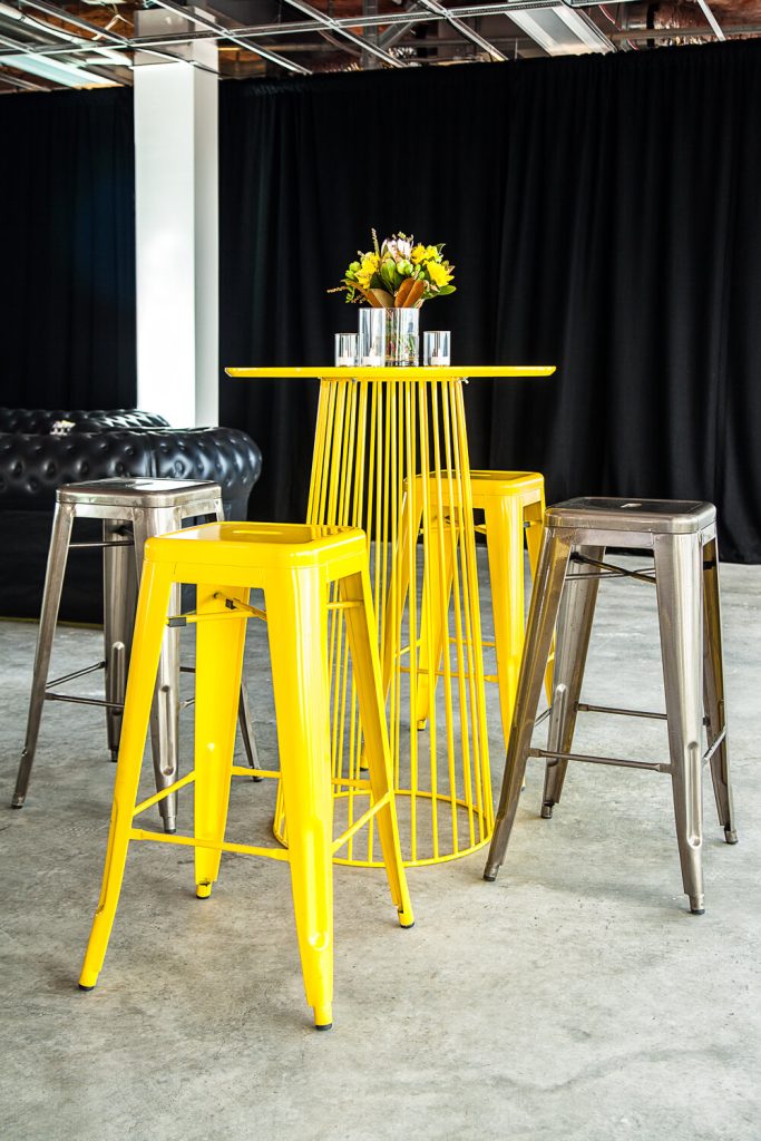 yellow and silver tolix stool