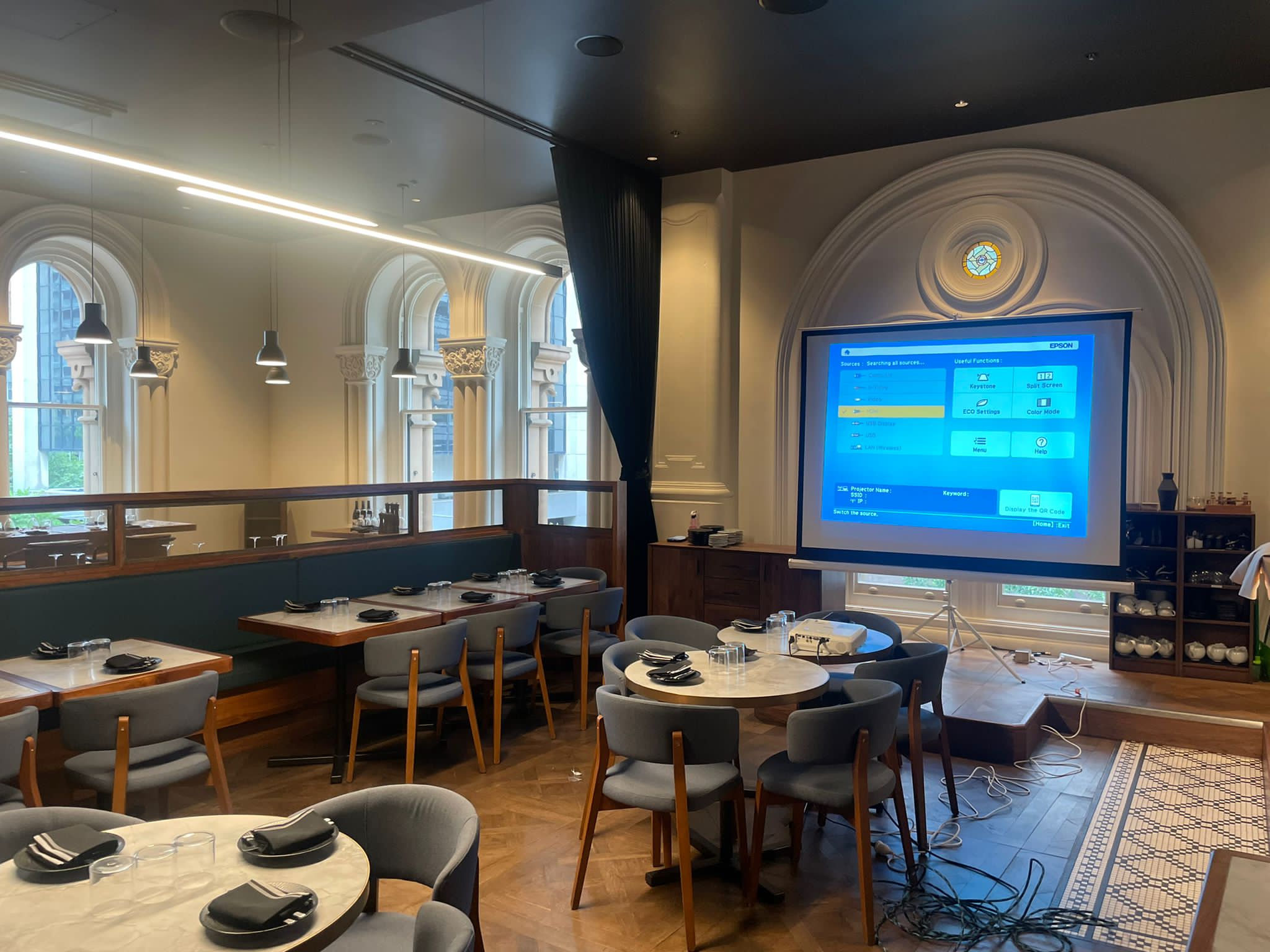 projector and screen set up at a venue.