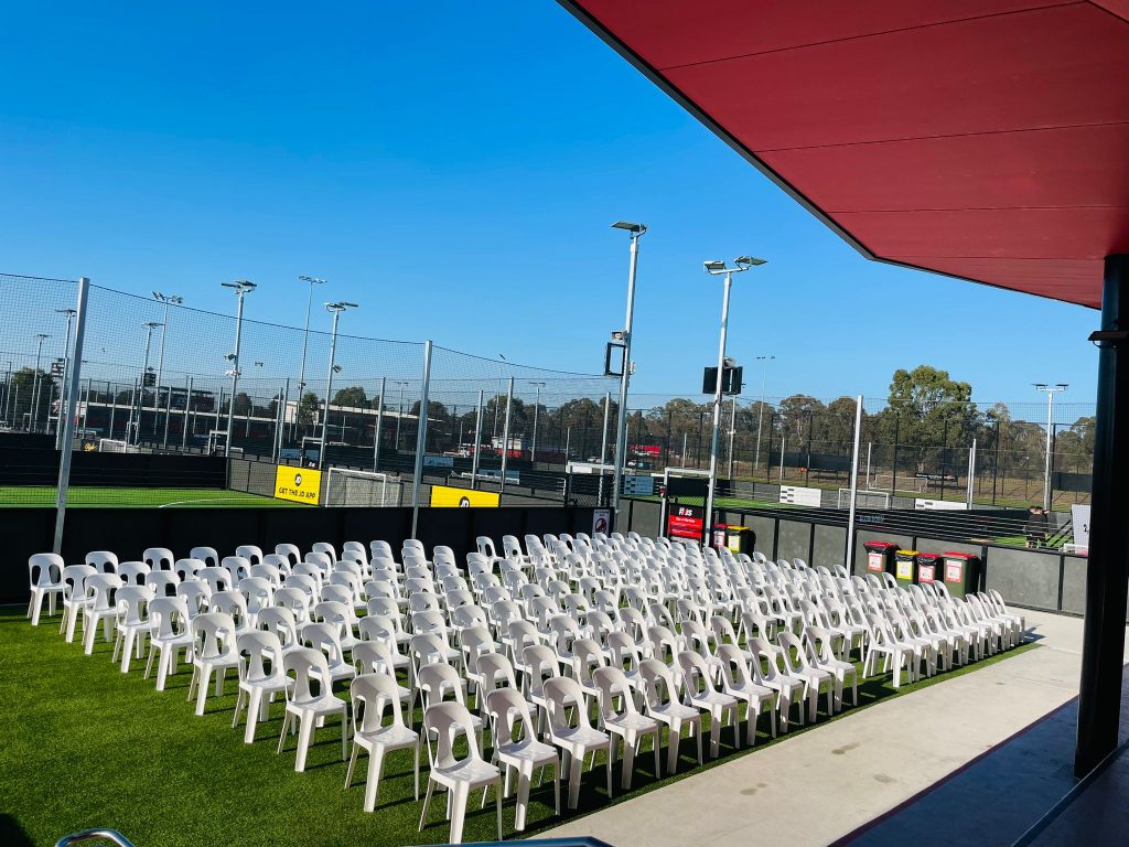 white plastic chair outdoors on tennis court