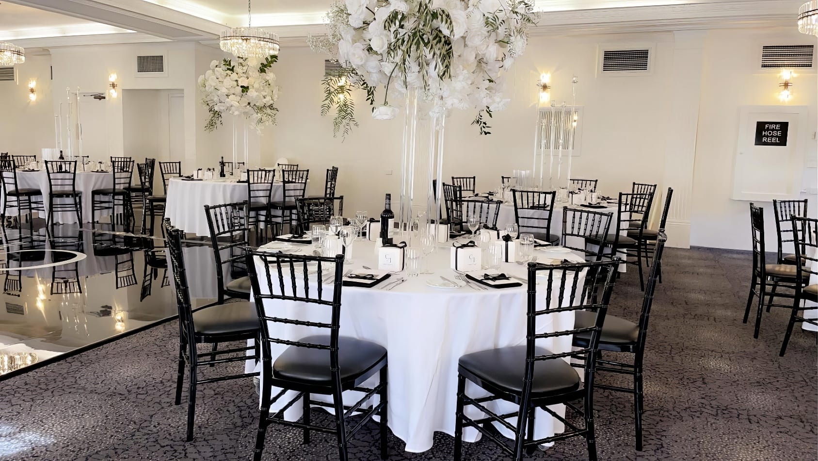 wedding reception with black tiffany chair hire
