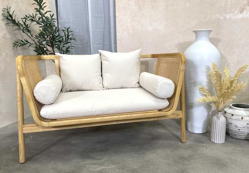 lounge set up with a natural rattan lounge hire