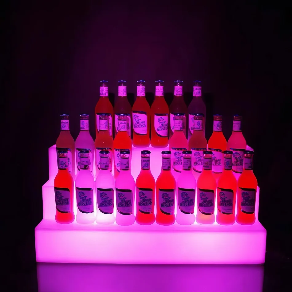 pink glow bottle shelf display with bottles on display
