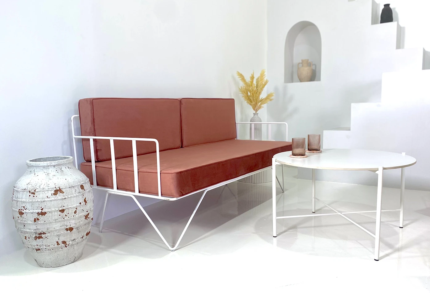 sofa lounge set with pink velvet wire sofa, a white coffee table